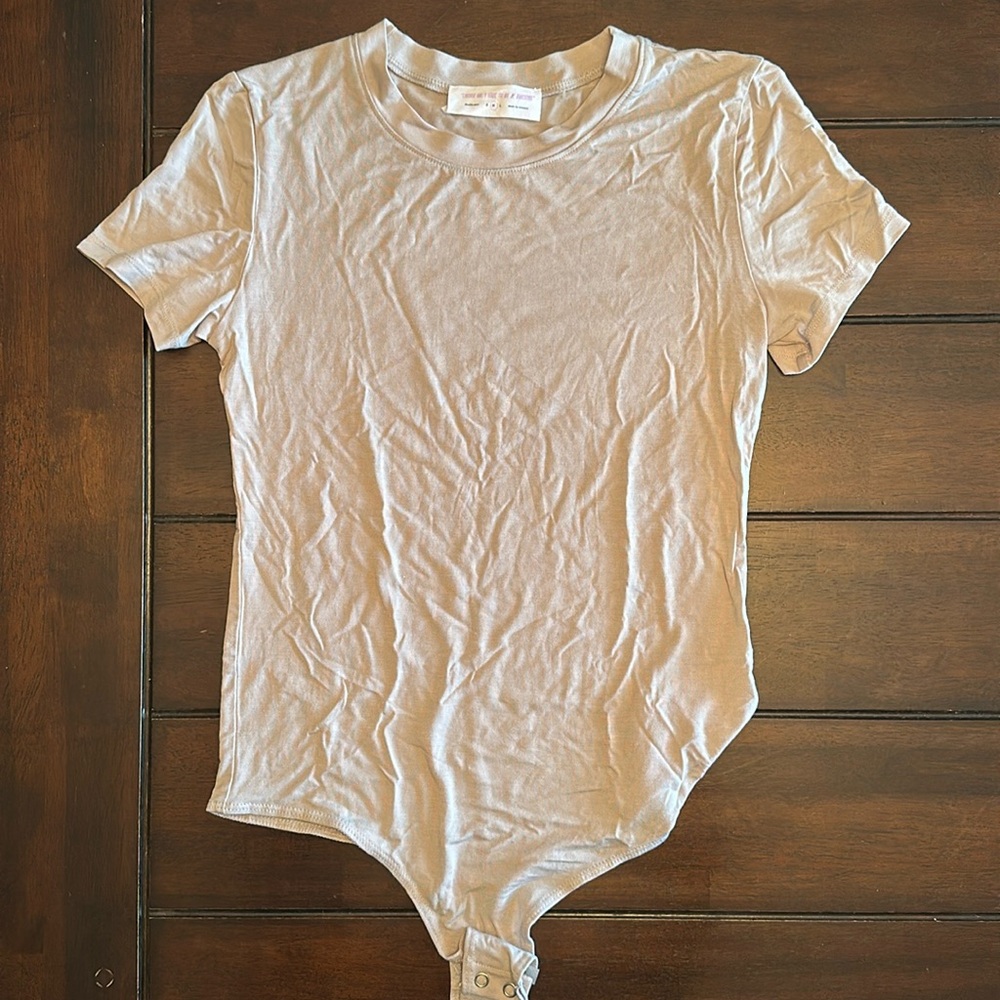 New! Tan/beige body suit size mediumum